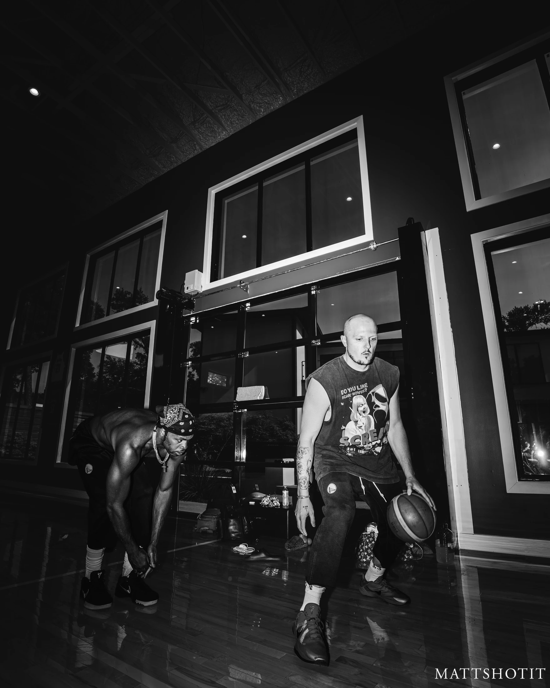 Trey Slate demonstrates ball control as Buddy Hield watches. Photograph by MATTSHOTIT.